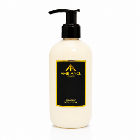 A light cream bottle with a black pump, featuring a black label with "Ancienne Ambiance London" logo and "Signature Body Lotion" in gold text. Clean and elegant design.