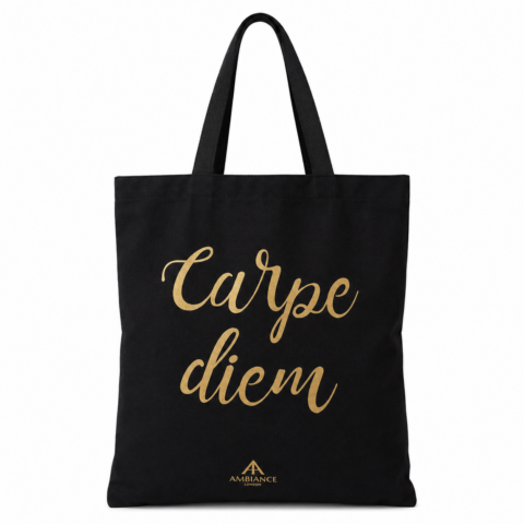 A black tote bag features the words "Carpe Diem" in elegant gold script. The bag exudes a motivational and stylish feel.