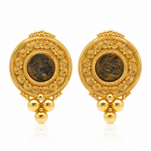 Pair of ornate, round 21k gold earrings featuring Ancient Roman coins. Intricate scrollwork and hanging gold spheres evoke an antique elegance.