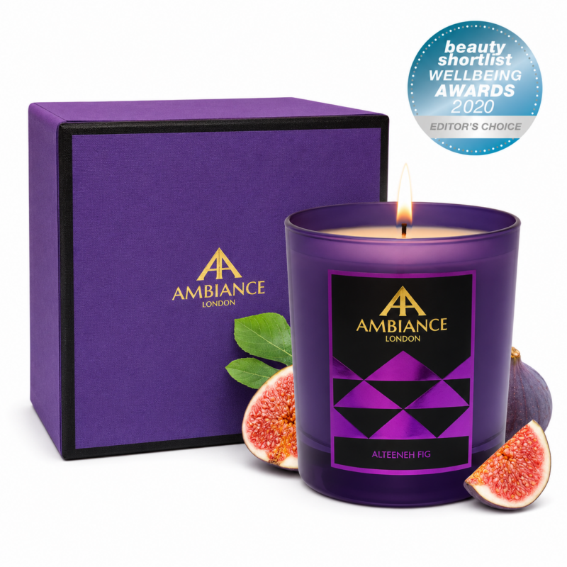 Purple luxury candle labeled "Ancienne Ambiance London Alteeneh Fig" with figs in front of a matching gift box and an award sticker on a white background.