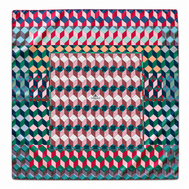 A vibrant, geometric pattern scarf with interlocking cubes in red, blue, green, and pink. It creates a bold, dynamic, and energetic visual effect.