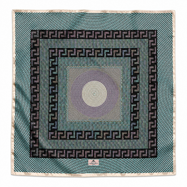 An elegant square silk scarf with intricate concentric circles and geometric patterns like a Roman mosaic. Dominant colours include teal, purple and black, creating a bold, artistic design.