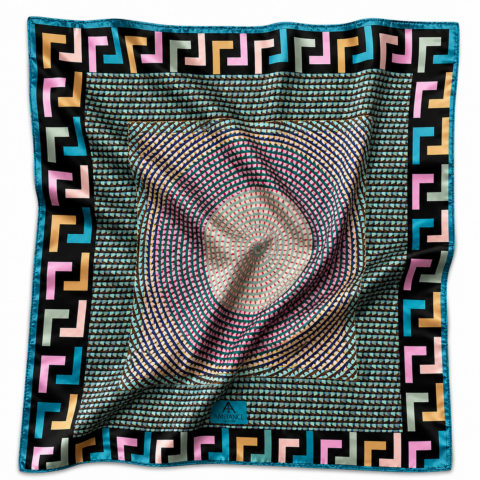 Colourful square silk scarf with geometric patterns. A central spiral in pink and beige contrasts with a bold blue border with Greek key design. Vibrant and dynamic.
