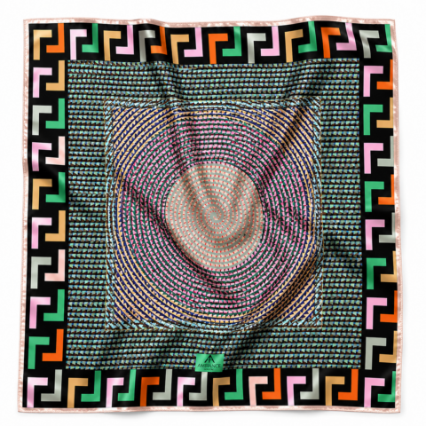 A colourful silk scarf with a central spiral pattern of small triangles in pink, green, and blue. The border features bold geometric shapes in black, pink, orange, and green, creating a vibrant, dynamic design.