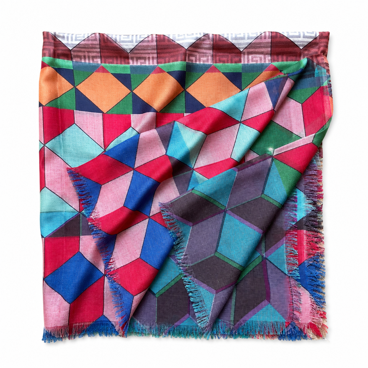 A colourful scarf featuring a geometric cube pattern in vibrant shades of red, blue, pink, and green with a fringed edge, conveying a lively elegant tone.
