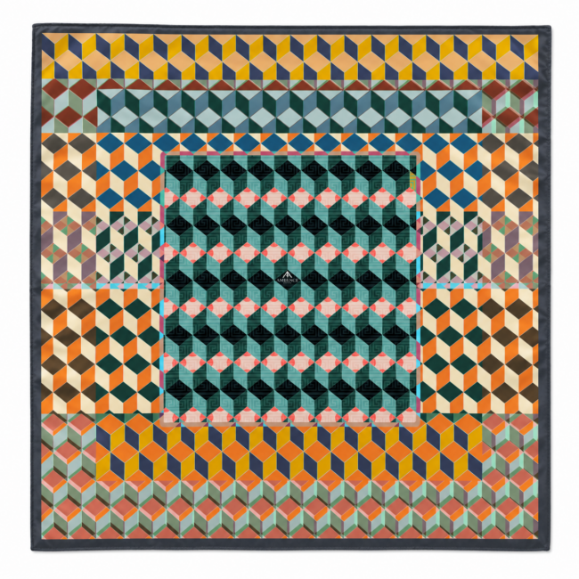 A vibrant cotton silk scarf with geometric pattern with repeating cubes in shades of orange, yellow, blue, and teal. The design creates a 3D effect.