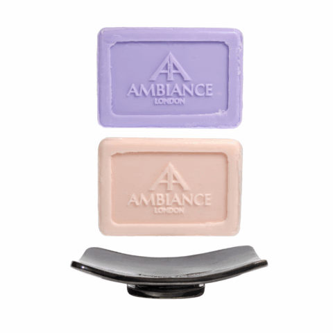 Two Soap bars with a ceramic soap dish