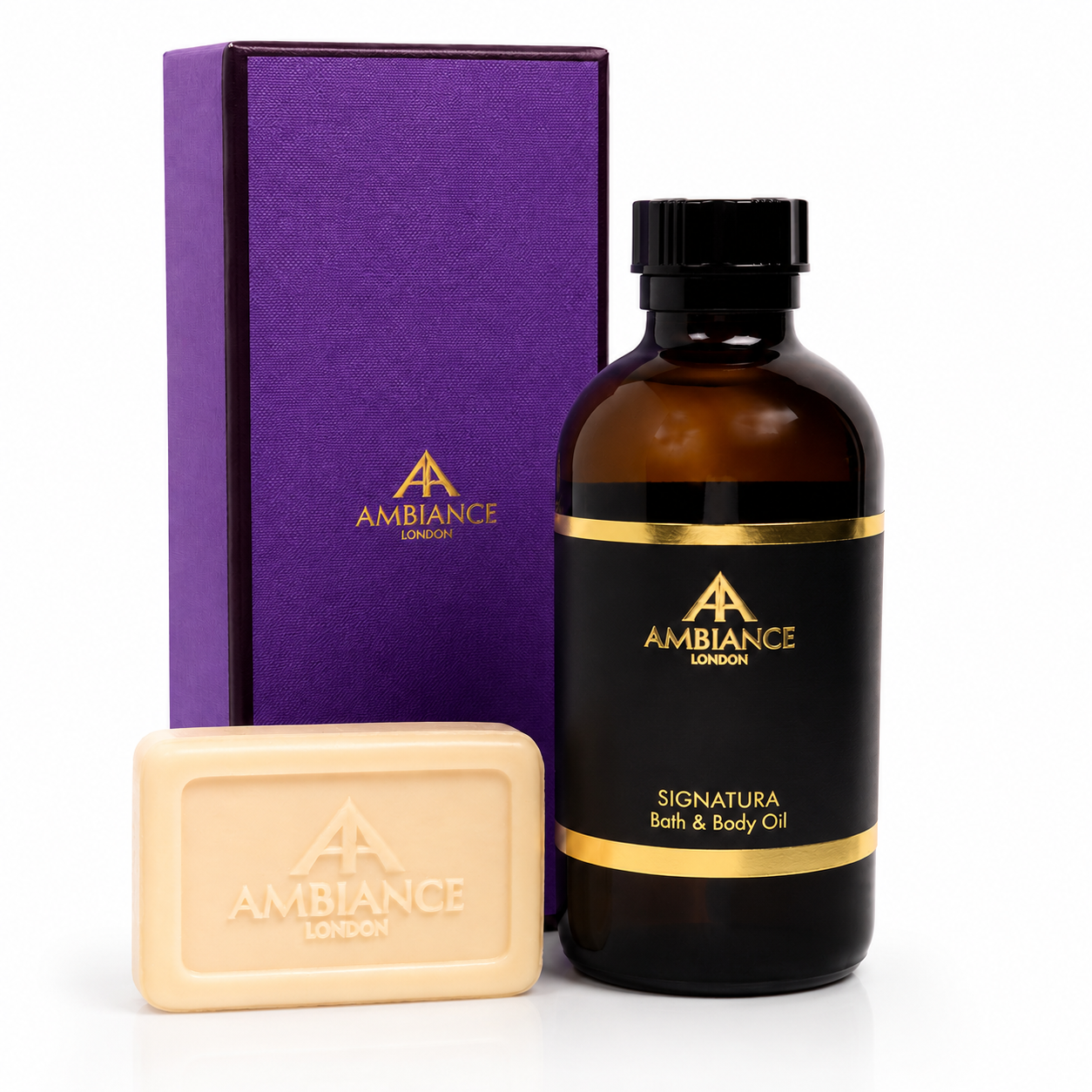 Elegant bath and body set featuring a purple box, amber bottle with gold accents labeled "Signatura Bath & Body Oil," and neroli orange blossom soap bar.