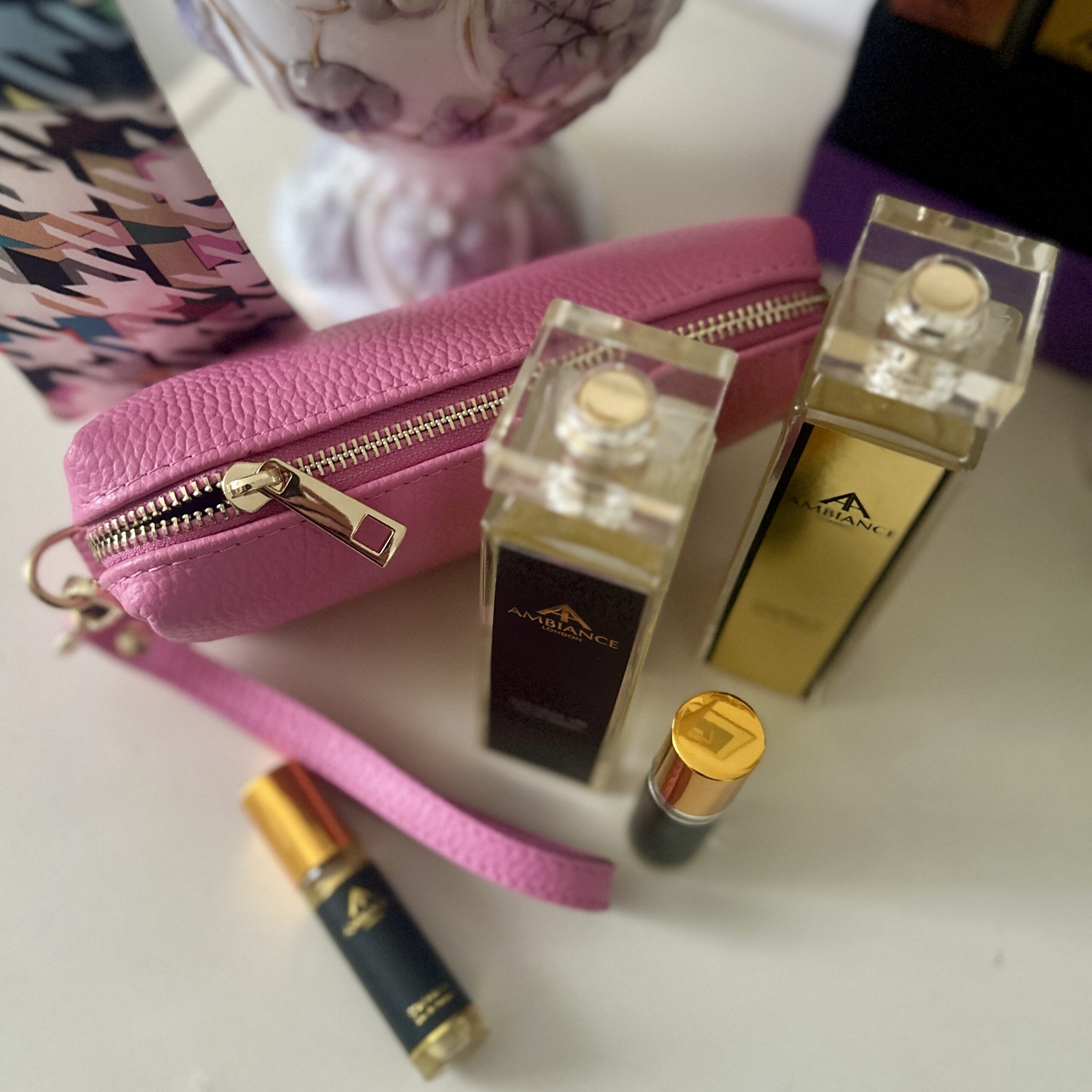 Pink bellezza leather pochette bag on vanity table