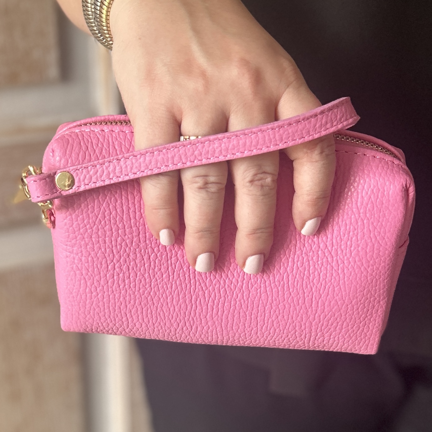 Pink bellezza pochette bag in hand