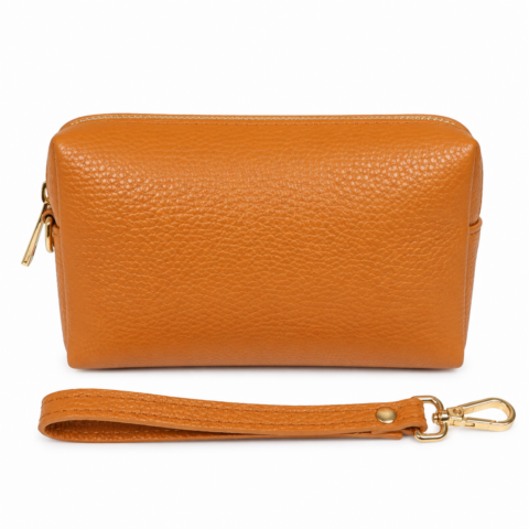 A small, tan pebbled leather bag with a detachable strap and gold clasp is shown on a white background, conveying elegance and simplicity.
