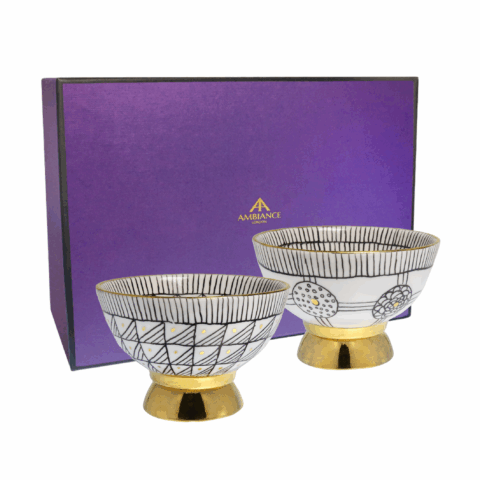 Set of two monochrome hand painted gold-plated porcelain pedestal bowls