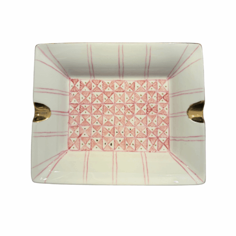 Rectangular ashtray with a textured pink and white grid pattern. It features gold accents on opposite sides, adding an elegant touch.