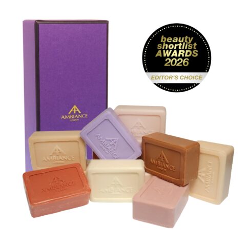A collection of colourful Ancienne Ambiance soaps is artistically arranged beside a purple Ancienne Ambiance London gift box. A "Beauty Shortlist Awards 2026 Editor's Choice" badge is displayed.