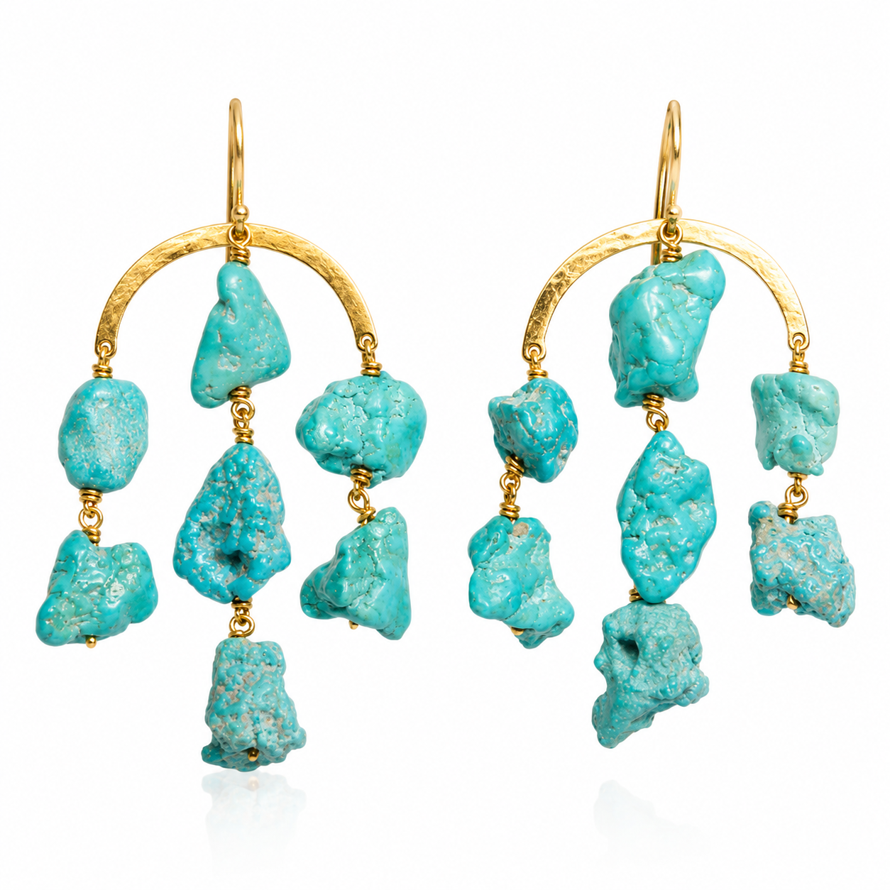 Gold arch earrings with dangling raw turquoise stones by Claire van Holthe. The design is rustic and elegant, conveying a bohemian and natural aesthetic.