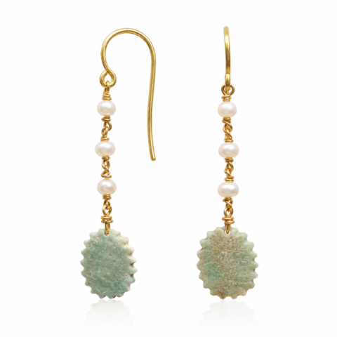 Gold earrings with a hook design, featuring three small white pearls and a textured, oval ancient Egyptian faience bead at the end, conveying elegance and simplicity.