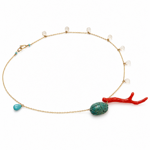 Delicate gold chain necklace featuring small clear beads, a turquoise teardrop, a red branch-like charm, and an ancient Egyptian faience scarab centrepiece.