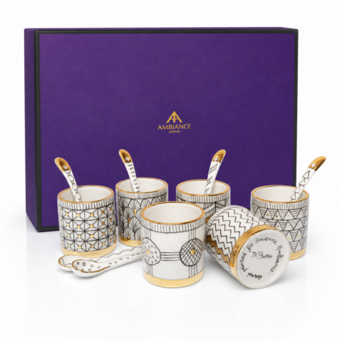 Set of six hand-painted espresso coffee cups with gold-plate geometric designs and matching spoons, displayed against a purple box Ancienne Ambiance London gift box. Elegant and luxurious.
