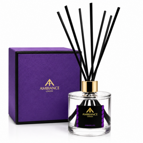 Elegant Adriatica Fig fragrance diffuser with black reeds in a clear jar, adorned with a gold cap. Purple box with "Ancienne Ambiance London" logo in gold, evoking luxury and sophistication.