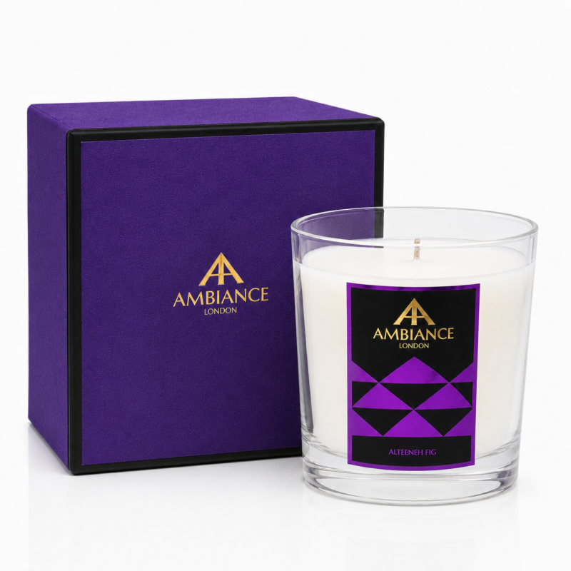 Luxury Ancienne Ambiance London "Alteeneh Fig" candle with creamy wax in a clear glass, featuring a geometric purple label. A matching purple box with gold branding sits behind it.