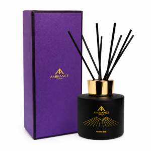 Purple Ancienne Ambiance London box with gold logo beside a black Amarna Rose diffuser with gold lid and black reeds. The design is elegant and luxurious, conveying sophistication.