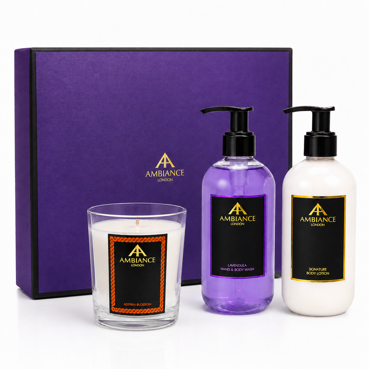 A luxurious gift set includes a purple box, an "Assyria Blossom" candle, lavender hand and body wash, and white body lotion. The brand logo, "Ancienne Ambiance London," is featured.