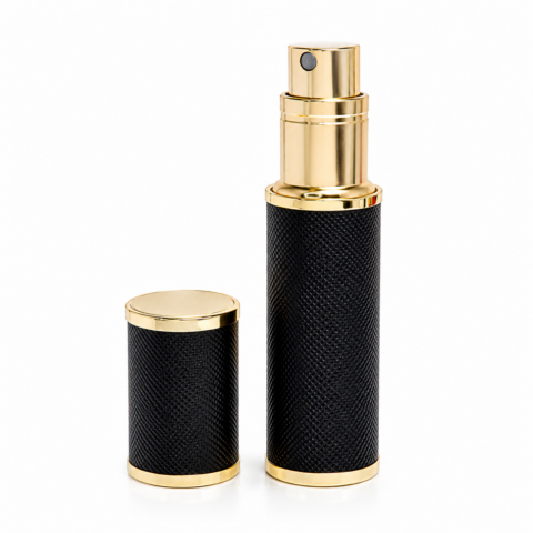 Black perfume atomizer with a textured finish and gold accents. The gold cap is placed beside the spray bottle, conveying elegance and luxury.
