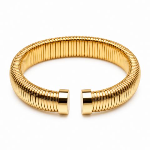 Sleek gold coiled bracelet with a reflective polished finish, open-ended design. Elegant and modern, placed on a plain white background.