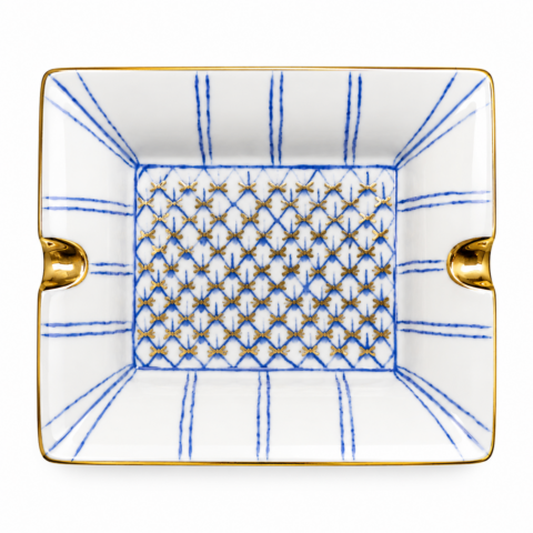 Rectangular porcelain vide poche tray with blue grid lines and gold flower pattern. Two gold-trimmed grooves on opposite sides. Elegant and ornate design.