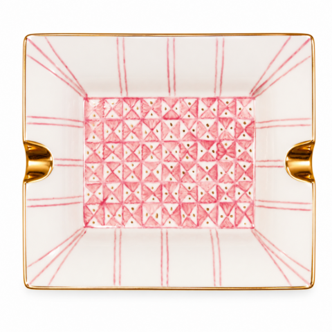 Rectangular ashtray change tray with pink geometric patterns and a triangular design inside. Gold trim and two notches on opposite sides. Elegant and modern.