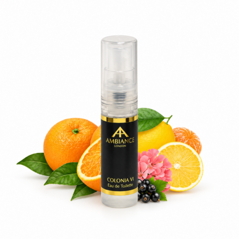 Perfume sample bottle labeled "Colonia VI" with citrus and floral accents. Surrounded by oranges, lemons, and pink flowers, creating a fresh, vibrant feel.