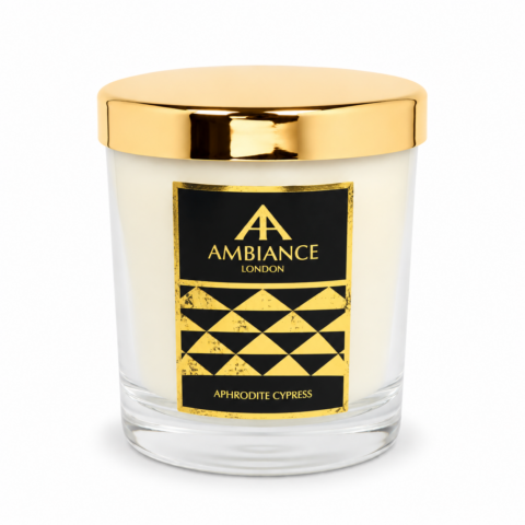 Aphrodite Cypress luxury scented candle by Ancienne Ambiance London in a clear glass vessel with a polished gold lid, shown on a white background.