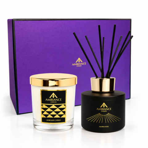 Ancienne Ambiance London bespoke home fragrance gift set featuring an Aphrodite Cypress candle and an Amarna Rose reed diffuser, presented with a purple branded gift box on a white background.